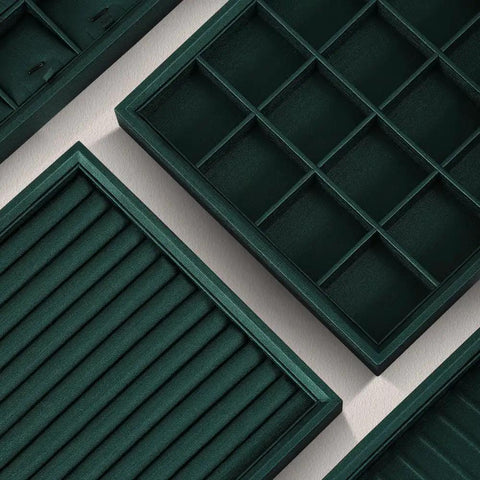 Top Tier PU Leather Jewelry Display Tray Featuring Twenty Four Secure Grid Slots For Rings Earrings And Brooches, dark green with various slot designs.