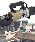Heavy Duty Electric Rebar Cutter And Bender Set 1800W with hydraulic mechanism cutting steel rods during construction work.