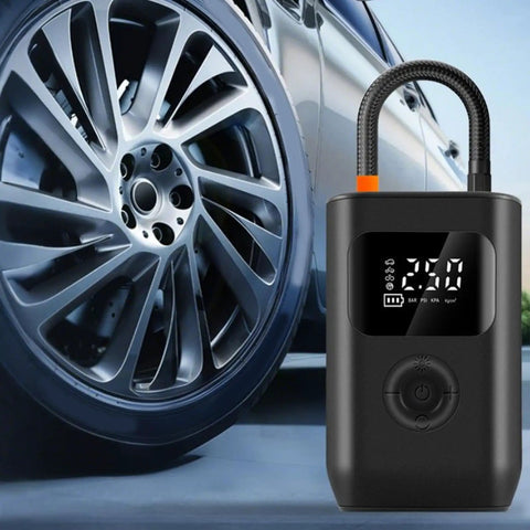 Slick Wireless Rechargeable Car Air Compressor Fast Tire Inflator With Easy Digital Display Auto Shutoff beside a car wheel.