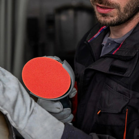 Close-up of Rock Solid 2000 Grit Orange Nylon Sanding Discs With Hook Loop Design for car repair and sanding projects.