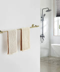 Gold Crystal Towel Bar With Adjustable Rack For That Boss Vibe Luxury Gold Finished Wall Mounted Towel Holder Space Saving Single Rail With Crystal End Balls And Bonus Hook For Bath Accessories in bathroom setting