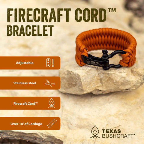Survival Firecraft Paracord Bracelet with adjustable stainless steel bow shackle on rock, camping and emergency use.