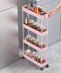 Four Tier Slim Storage Cart With Rolling Wheels For Narrow Gaps And Tight Spaces 38.7 Inch Tall Mobile Shelving Unit in Pink next to fridge