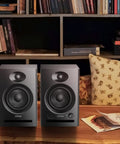 Dual Mode Two Point Zero Studio Monitors For Near Field Music Production Bluetooth Five Point Three Bookshelf Speakers on desk