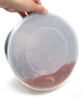 Tempered Glass Lid And Silicone Cover For Instant Pot 6 Quart Set Of 4 Accessories showing silicone cover held by hand