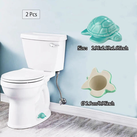 Heckin Adorable Ceramic Sea Turtle Toilet Bolt Caps Set Of 2 Snazzy Screw Cover beside a toilet for decorative use.
