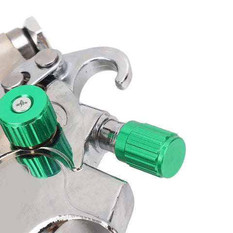 Close-up of green adjustment knobs on Professional Grade Hvlp Paint Sprayer Kit With Six Hundred Mil Gravity Tank And Three Nozzle Heads.