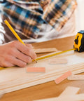 Person measuring wood with tape, Wooden Dowel Pins M8x30mm For Furniture Assembly Solid Round Dowels In Beige on table