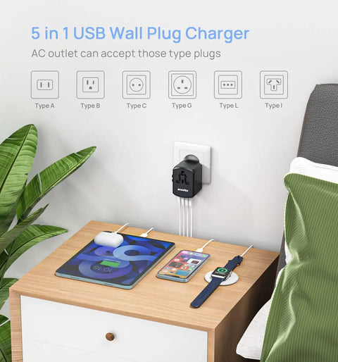 Global Travel Power Adapter With 4 USB Ports And 160 Country Coverage charging multiple devices on a nightstand.