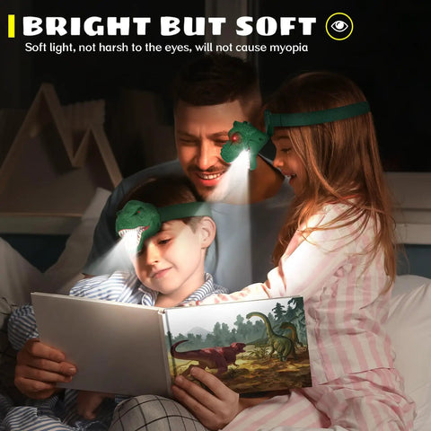 Family reading with Dinosaur Headlamp For Kids And Adults With Four Modes LED Headlamp, showing dinosaur book at night.