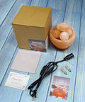Himalayan Pink Salt Lamp Bowl With Heated Massage Balls For A Cozy Natural Salt Rock Table Lamp Vibe From Pakistan For Home Gifts Includes 2 Replacement 25W Bulbs And Hand Carved Taly Wood Base next to packaging and accessories.