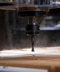 Close-up of Up Spiral Router Bit with TiCo Hi-Density Carbide in CNC router cutting wood, 3/8 inch diameter and 1-1/4 inch height.