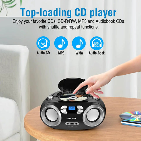 Person using Portable CD Player Boombox With FM Radio Bluetooth USB Port And Aux Input For Home Or On The Go Compact Easy Use Design