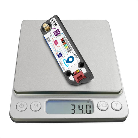 LoRa 1262 Long Range Module With SX1262 Chip And AT6668 GNSS For Cardputer on scale showing 34.0 grams