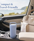 Portable Breastmilk Cooler Bag Featuring Double Walled Stainless Steel Insulation in car cup holder, ideal for on-the-go use.