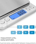 Close-up of Pocket Scale 3000g x 0.1g with LCD display showing zero, tare function, multiple measurement units. Battery powered, compact design.