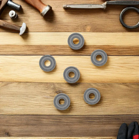 Silky Smooth 10 Pack Zz Miniature Deep Groove Ball Bearing With Double Shields For Roller Skates Robots Crafts And Scooter Wheels Harsh Environment arranged on wood.
