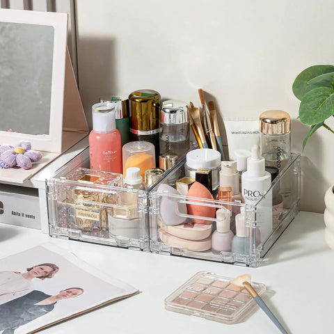 Foldable Plastic Storage Baskets With Handles 2 Pack on a desk, filled with cosmetics and brushes, visible side view.