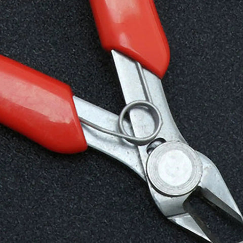 Close-up of Two Pack Stainless Steel Wire Cutter Pliers With Sharp Nose For Easy Wire Cutting And Stripping on dark surface