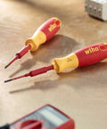 Insulated SlimLine Ultra Driver Blade Set with Slotted and Phillips Bits, 7 Piece Kit on workbench, close-up view.