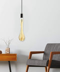 Oversized Edison Style Light Bulbs With E26 Base Amber Glass 4W Warm White 2200K Dimmable LED Filament Bulbs in lounge setting