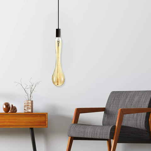 Oversized Edison Style Light Bulbs With E26 Base Amber Glass 4W Warm White 2200K Dimmable LED Filament Bulbs in lounge setting