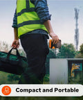 Heavy Duty Industrial Label Maker With Slick Bluetooth Pairing And No Sweat Job Site Organization Featuring Crisp 300 Dpi Prints On Half Inch Self Laminating Nylon Rolls Plus Heat Shrink Tubing For Electrical Wiring Tasks held by worker in reflective vest.