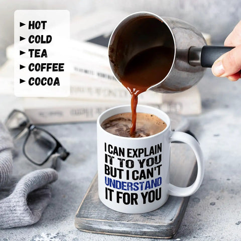 Funny Engineer Coffee Mug I Can Explain It To You But I Cant Understand It For You Gift For Engineers Teachers Managers Coworkers Boss Doctors 11 Oz Ceramic Coffee Mug For Home Office Desk Humorous Techie Gift shown with coffee being poured next to glasses and grey wool gloves.