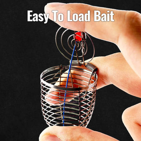 Close-up of Pro Grade Stainless Steel Bait Cage Ten Pack For Carp And Catfish Fishing held between fingers, open lid showing bait loading