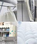 Inside view of Hella Spacious Portable Wardrobe Closet With Reinforced Metal Frame And Dual Hanging Rods showing fabric cover and hanging rods.