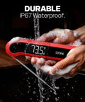 Person washing 0.3 Second Instant Read Digital Meat Thermometer For Cooking And Grilling under running water showcasing waterproof feature.