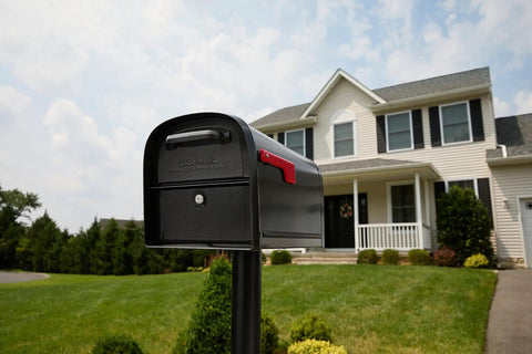 Oasis 360 Locking Parcel Mailbox Extra Large with black powder coat finish in front of a suburban house