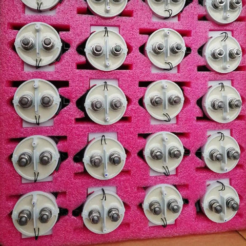 Straight Up Rugged High Voltage DC Contactor Relay 900V 500A With 12-24V Coil, close-up of relays mounted in foam.