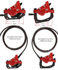 Front view of red 4-piston hydraulic brake kit for e-bike with 180mm rotors and long hoses
