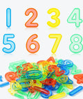 Image of a 48 Pieces Plastic Numbers And Symbols Early Math Set For Light Table Manipulatives In Durable ABS Material With Bright Translucent Colors For Engaging Hands On Learning And Fun, shows colorful numerals and symbols in red, blue, green, and yellow.