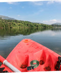Kayak on lake with heavy duty kayak roof rack straps, quick buckles, durable aluminum zinc and polyester construction