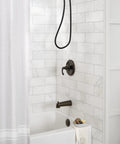 Bathroom interior with Magnetix Six-Function Detachable Handheld Showerhead With Magnetic Docking System In Mediterranean Bronze