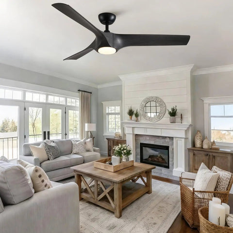 56" Farmhouse Reversible Ceiling Fan Light with Dark Gray ABS Blades installed in a bright, airy living room with a fireplace.