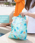 Waterproof Wet Dry Bag For Travel And Baby Gear, Mom Tested Reusable Zipper Pouch in Ocean Life Blue by poolside