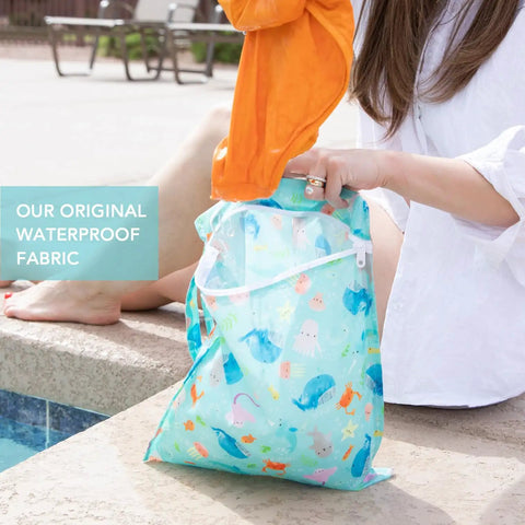 Waterproof Wet Dry Bag For Travel And Baby Gear, Mom Tested Reusable Zipper Pouch in Ocean Life Blue by poolside