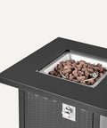 Outdoor Fire Table With 50,000 BTU Square Fire Pit, Black Finish, 28 Inch Diameter, showing lava rock heat source and control