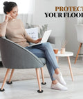 Four Pack Three Inch Round Rubber Furniture Caster Cups Delivering Real Floor Defense with cushioning under a chair.