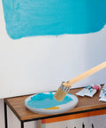 Wood Handle 50mm Round Bristle Paint Brush for Precise Edge Painting in Home Walls with blue paint application