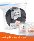 Sealed bag containing 3D printer filament and Molecular Sieve Desiccant Powder Packs For 3D Printer Filament Drying And Storage, 20g Each, 30 Packs, Zeolite Desiccant That Keeps Moisture In Check And Keeps Filament Dry For Crisp, Reliable Prints.