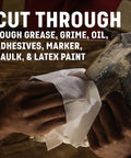Hands using Grimy Scrub Workshop Wipes With Scrubbing Beads For Grease Grime Oil Paint And Caulk on a dirty tool