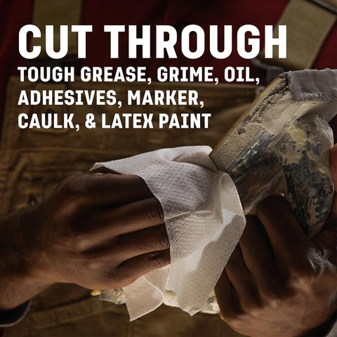 Hands using Grimy Scrub Workshop Wipes With Scrubbing Beads For Grease Grime Oil Paint And Caulk on a dirty tool