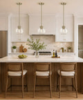 MQMQA 2 Pack Globe Pendant Lights, Mid Century Brass Pendant Light Fixtures hanging over a kitchen island with glass shades.
