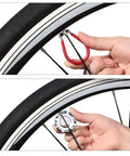 Hand using Six Piece Bicycle Spoke Tool Kit With Tire Lever For On The Go Bike Repair Includes Two Eight Cut Open Wrenches Two Rubber Handle Spoke Wrenches One Double Head Spoke Wrench And A Handy Rim Repair Pocket Set on bike wheel