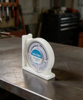 Digital Inclinometer Angle Finder With Magnetic Base for Pros and DIYers shown on workbench
