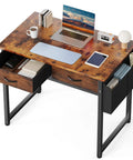 32 Inch Home Office Desk With Drawers And Storage For Gaming, Study Or Writing, Includes Fabric Drawers, Side Storage Bag, Headphone Hook, And Adjustable Feet In Rustic Brown with laptop and accessories on top.